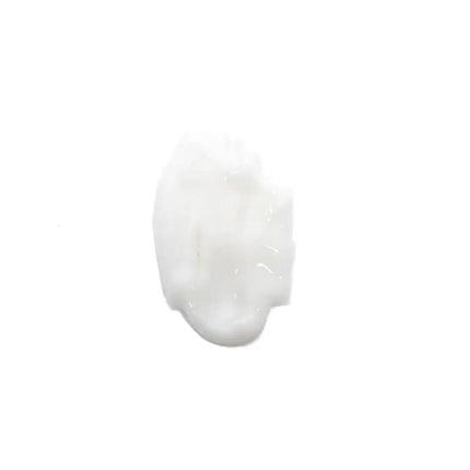 A dollop of thick, glossy white cream or lotion on a solid white background.