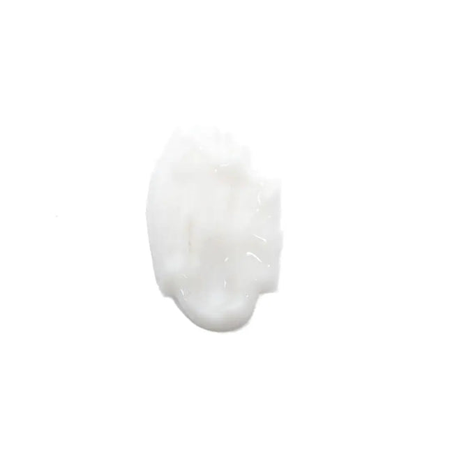 A dollop of thick, glossy white cream or lotion on a solid white background.