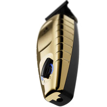 Gold and black device with a prominent button on a white background GTX-EXO® II Gold Trimmer