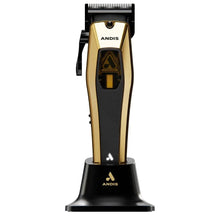 Gold and black Andis hair clipper on a white background
