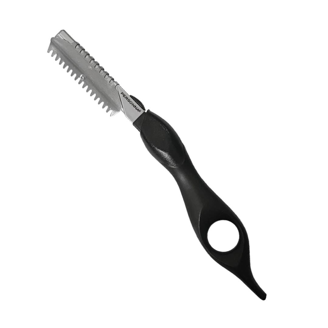 A black and silver grooming saw with a textured handle and serrated metal blade, shown on a plain white background.