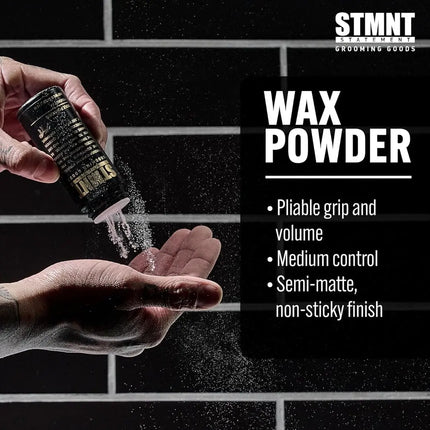 Person applying wax powder from a container to their hand with a black brick wall background.