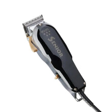 “Close-up of zero-gapped #2191 fade blade cutting hair for a skin fade.”

