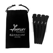 Black hair clips with 'Amplify the Stylist' branded pouch on a white background