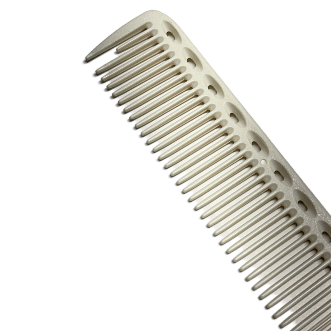 “Close-up of Barber Works 7.25-inch comb highlighting finely spaced and standard-spaced teeth.”


