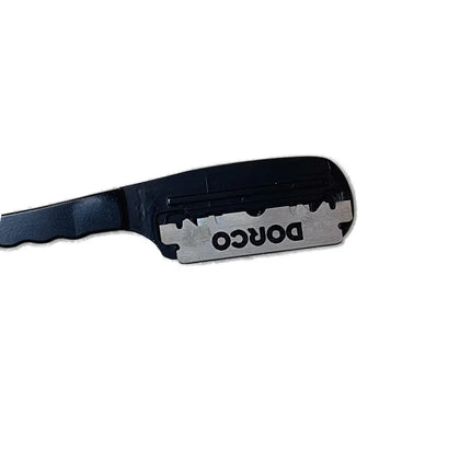 A close-up of a black plastic razor handle with a silver metal blade, featuring the brand name 'DORCO' printed in black on the blade.
