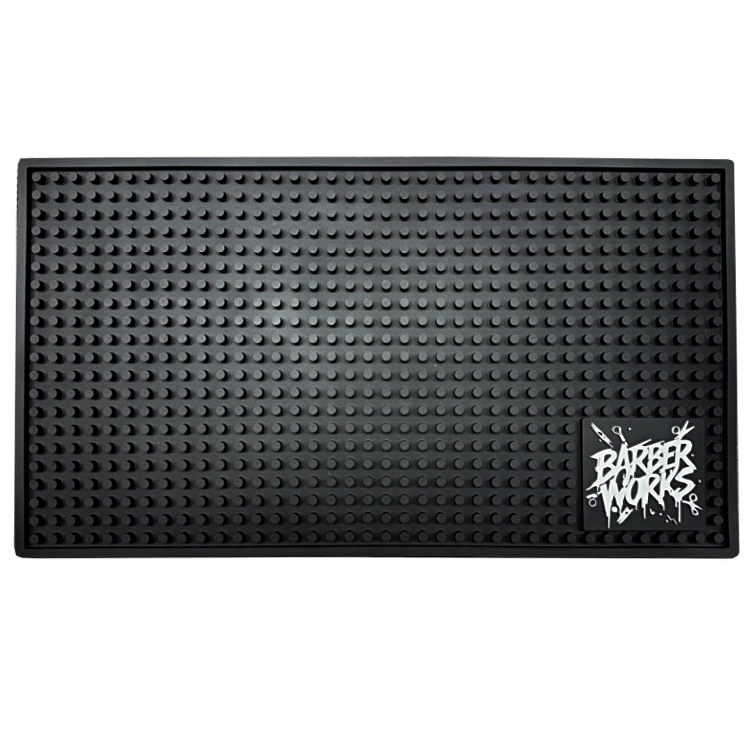 “Heat‑resistant Barber Works tool mat 17.5 × 10 inches on Las Vegas barbershop workstation”


