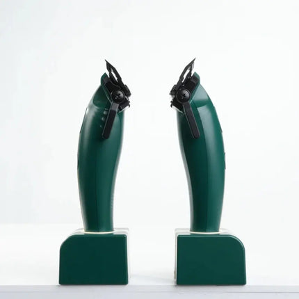Two green mechanical devices on a white background