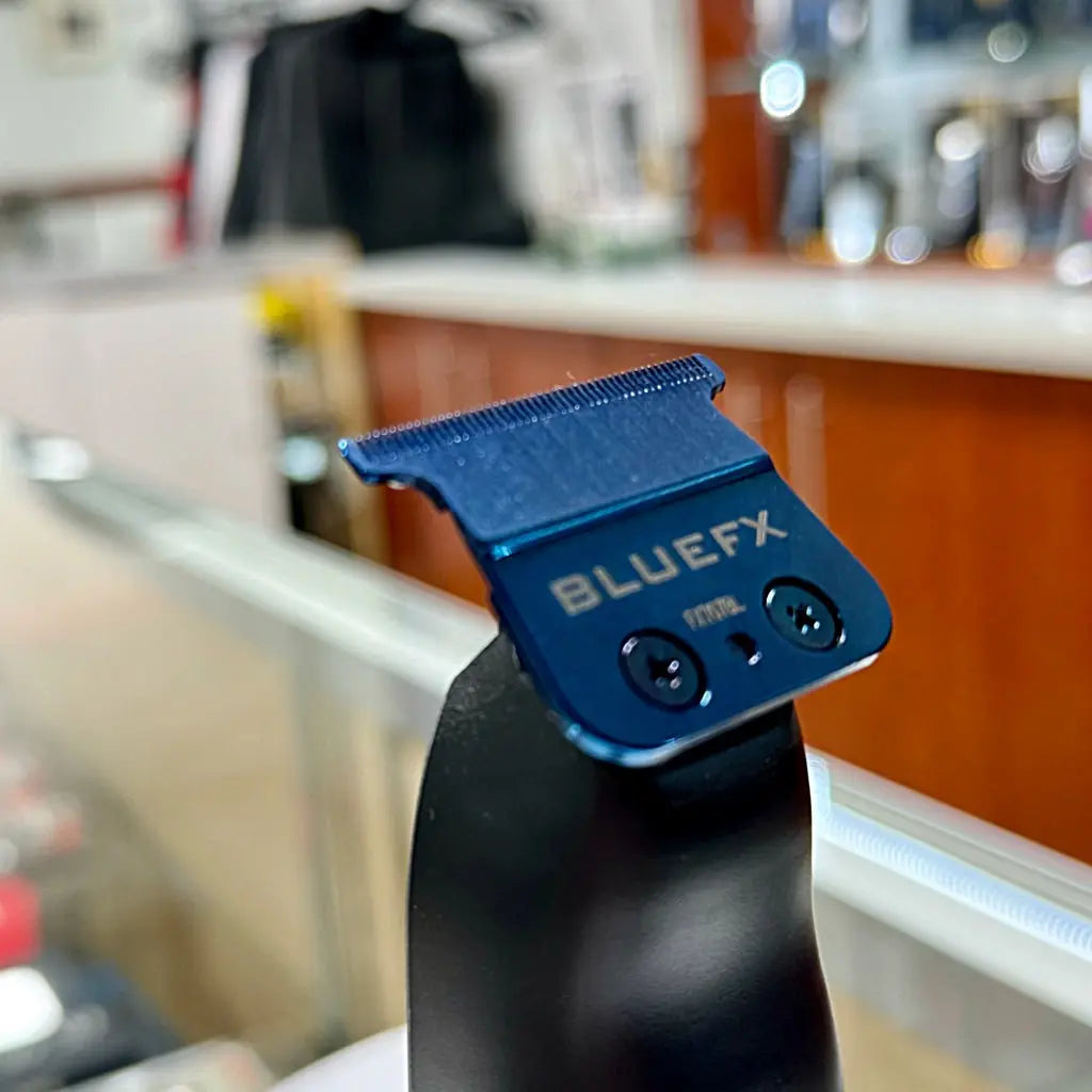 Image of BaBylissPRO FXOne Replacement Blade in packaging, emphasizing its compatibility with multiple BaBylissPRO models and lower blade temperature technology.