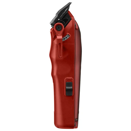 A red cordless clipper shown in a side profile view against a solid white background.