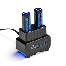 Babyliss Black battery charger with two blue batteries on a white background