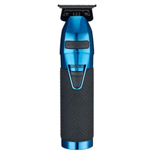 Blue and black babyliss hair trimmer on a white background