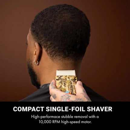 BaBylissPRO Camo LO-PROFX Compact Single-Foil Shaver (Limited Edition) Person holding a compact single-foil shaver against a brown background