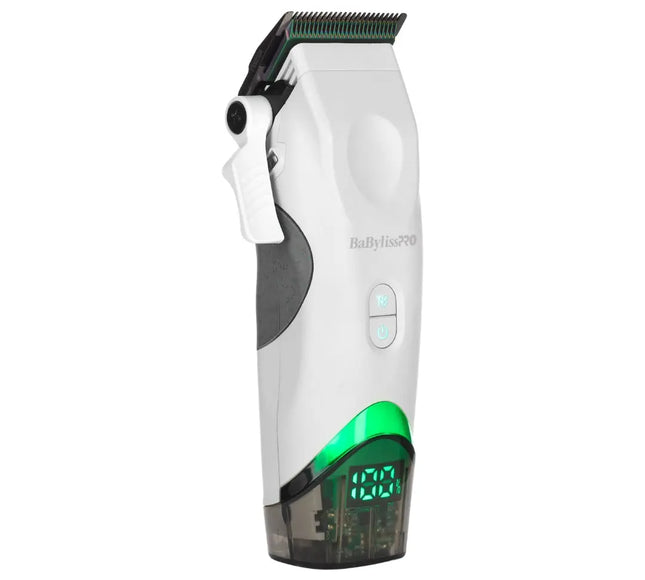 A white and grayBaBylissPRO Tomb45 White Wireless cordless hair clipper with a green illuminated trim line and a transparent collection container at the base, shown on a solid white background.