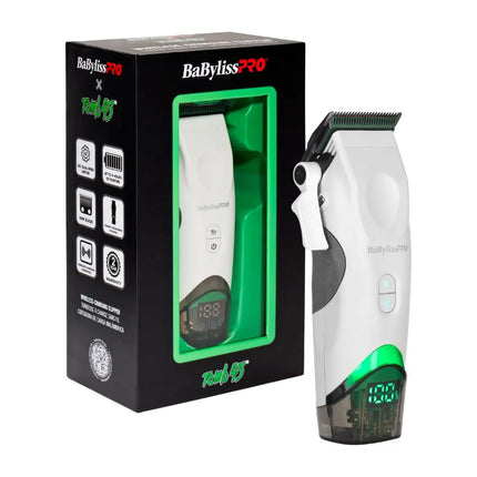 BaBylissPRO Tomb45 White Wireless clipper shown next to its retail packaging box. The clipper is white with a green illuminated base and a black clipper head, while the box is black with green and white branding.