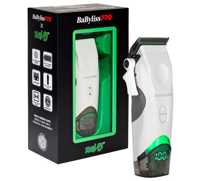 BaBylissPRO Tomb45 White Wireless clipper shown next to its retail packaging box. The clipper is white with a green illuminated base and a black clipper head, while the box is black with green and white branding.