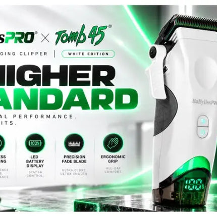BaBylissPRO x Tomb 45 wireless charging clipper in white with green accents, shown on a reflective surface with promotional text and green lighting in the background.