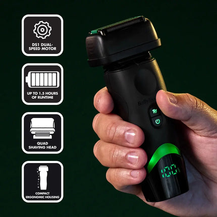 A hand holding a black Baby Deep Clean electric Babylisspro tomb45 Shaver with green illuminated accents, shown against a dark green background with four feature callout icons on the left.