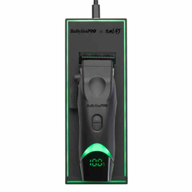 A BaBylissPRO x Tomb45 wireless charging pad with an aligned clipper on it, showing the LED rim indicator and USB-C port.