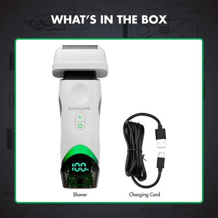 A boxed product presentation showing an babyliss shaver and its charging cord on a dark background with the headline 'WHAT'S IN THE BOX.' The shaver is white with a green illuminated display and green accent band near the base.