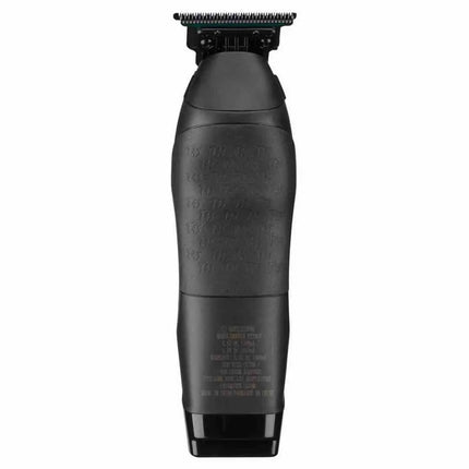 "Magnetic hair pocket door open on the BaBylissPRO x Tomb45 Trimmer for easy cleaning"
