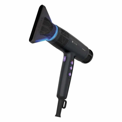 A black hair dryer with purple buttons and a blue light accent on the nozzle, shown against a solid white background.