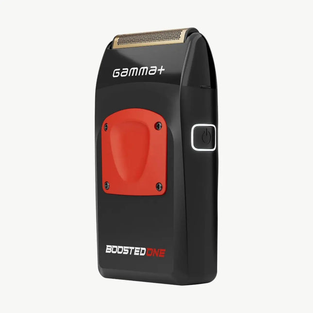 A black and red Gamma+ Boosted One electric shaver with a gold-toned metallic shaving head, shown on a light gray background.
