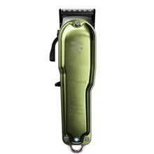 Green Wahl grooming clipper on a white background