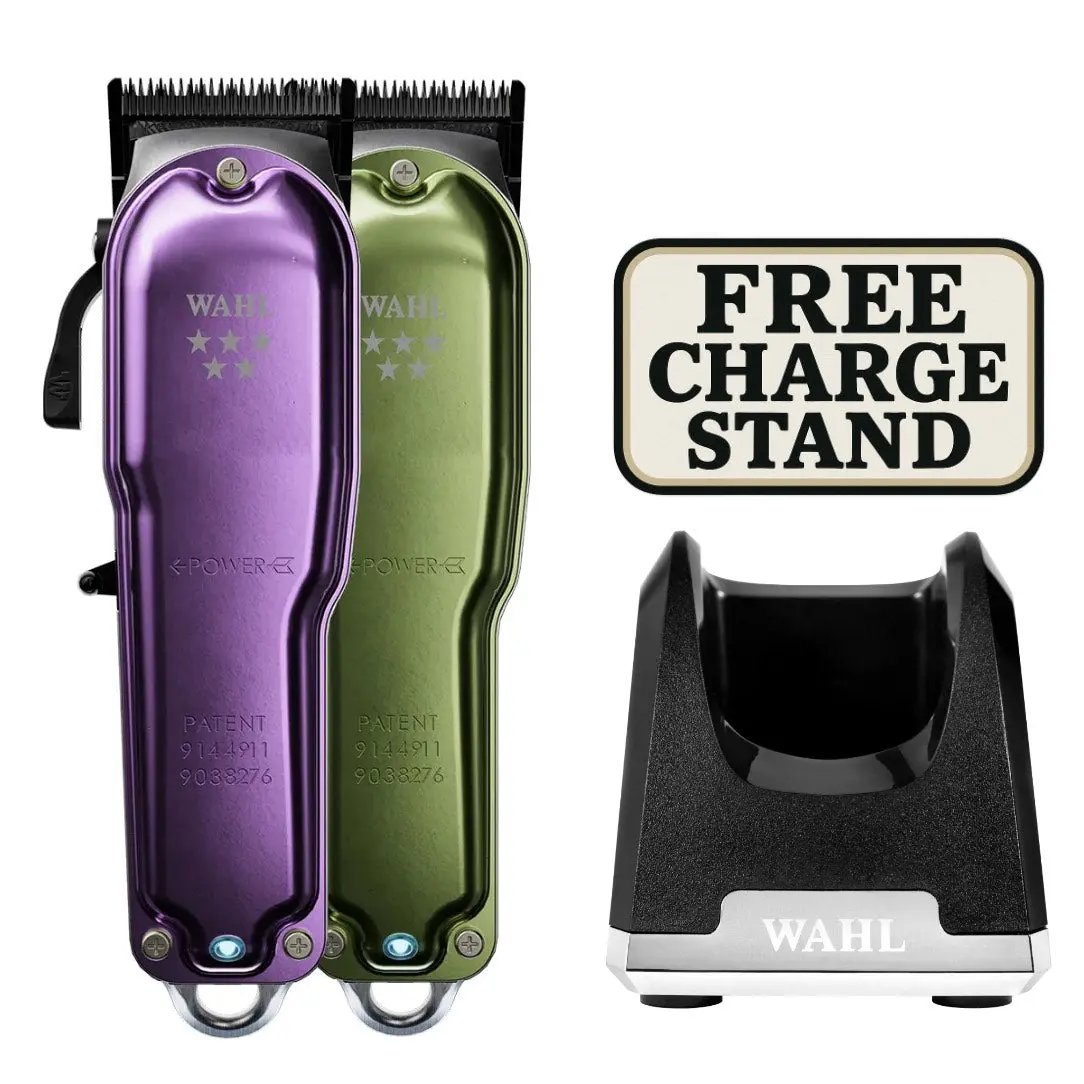 Purple and green Wahl hair trimmers with a free charge stand on a white background