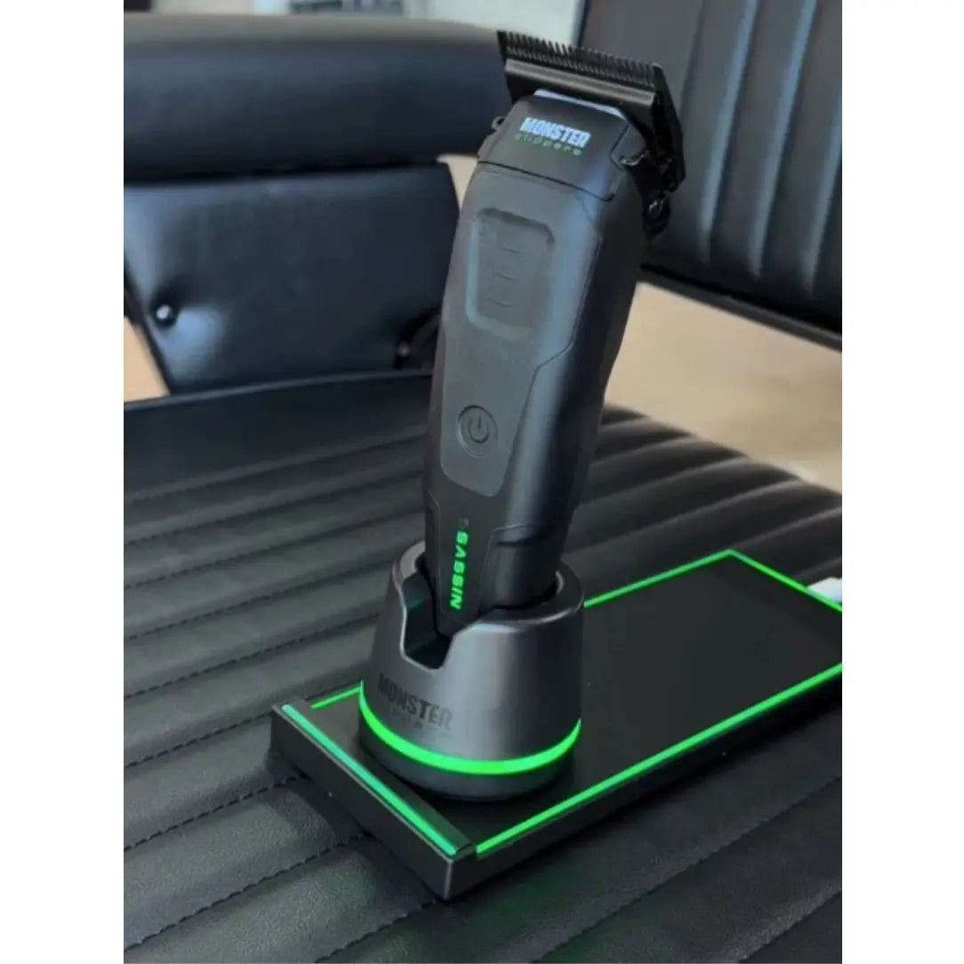 Monster Clippers Assassin Clipper Grooming tool on a charging stand in a car seat