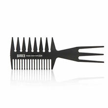 “Marmara BARBER Wide Tooth Comb Nº 034 held by a barber, showing its sturdy build”
