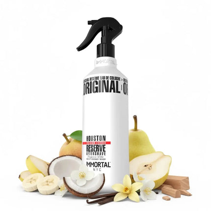 A bottle of Houston Reserve aftershave with fruit and vanilla elements on a white background