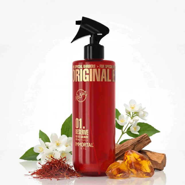 Reserve 01 Gold Edition After Shave Cologne Red bottle with black pump labeled 'Original' surrounded by flowers and amber on a white background