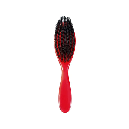 A red oval hairbrush with black bristles, shown vertically against a plain white background.