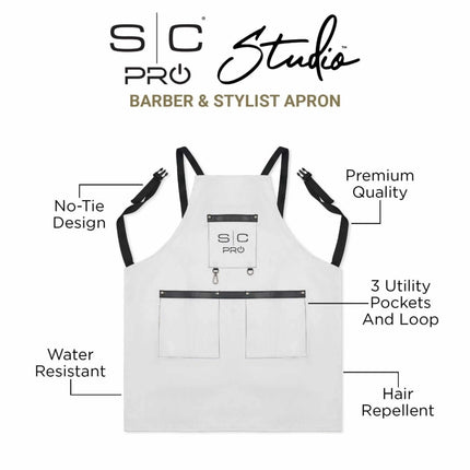 StyleCraft Pro Apron White barber and stylist apron with black straps on a white background, featuring S/C Pro Studio branding.