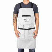 StyleCraft Pro Apron Person wearing a white apron with black accents and a logo on a white background