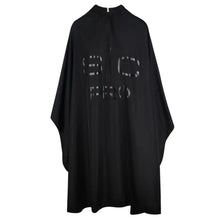 Black barber cape with 'BOC' branding on a white background
