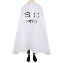 White barber cape with 'SC Pro' logo on a white background