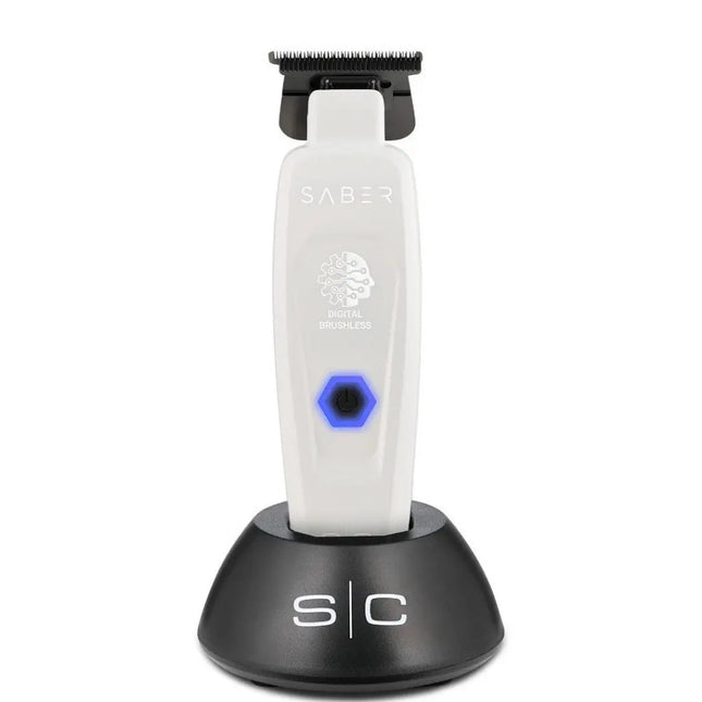 Saber grooming tool with black and white design on a white background