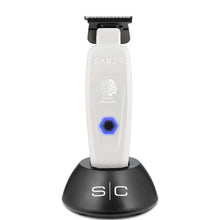 Hair trimmer with charging stand on a white background