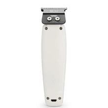 White hair trimmer with black top on a white background