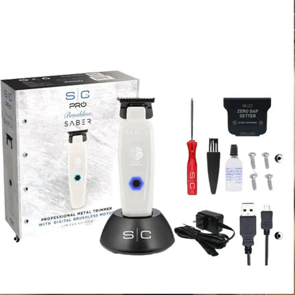 Professional grooming kit with trimmer, accessories, and packaging on a white background