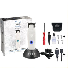 Professional grooming kit with trimmer, accessories, and packaging on a white background