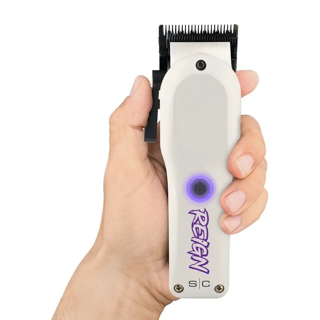 Hair clipper with visible brand logo held in a hand against a white background