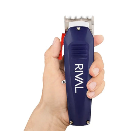 Hand holding a Rival Metal Hair Clipper with Digital Display blue Rival hair clipper against a white background