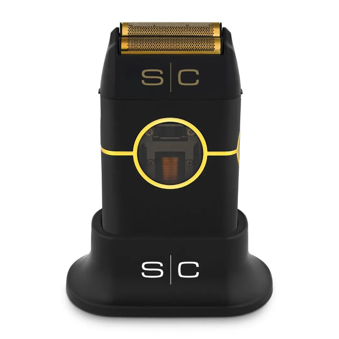 “Instinct Metal Shaver with gold titanium foils and dual cutters on charging base”