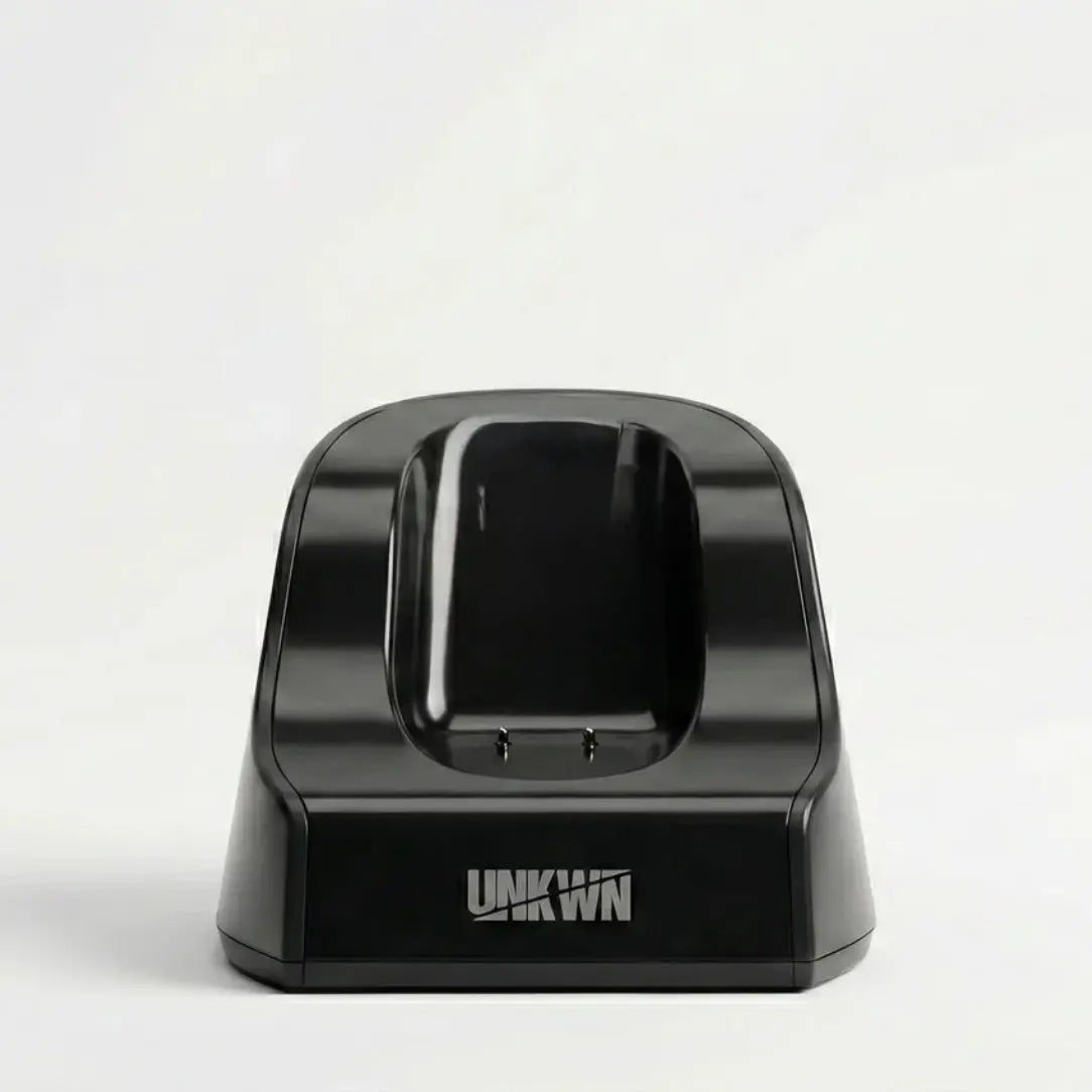 Black electronic device dock with 'UNKWN' branding on a white background