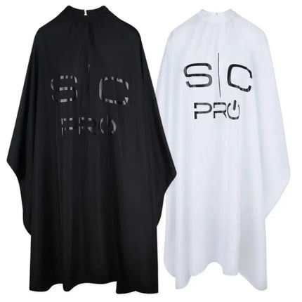 Black and white barber aprons with 'SC Pro' logo on a white background