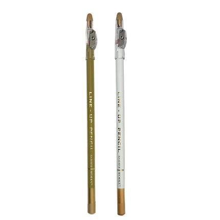 Barber Works  line-up pencil, one gold and one white, on a white background