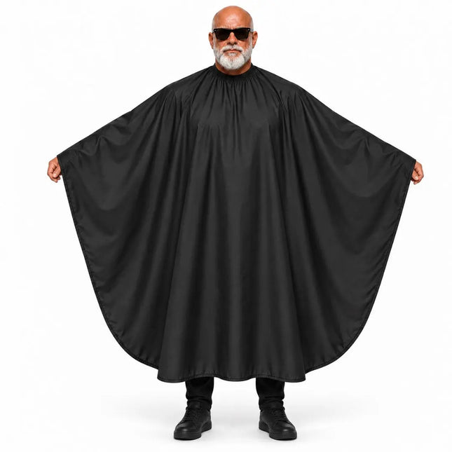 A man with a white beard and sunglasses wearing a large black cape-style poncho, holding the wide sleeves out against a plain white background.